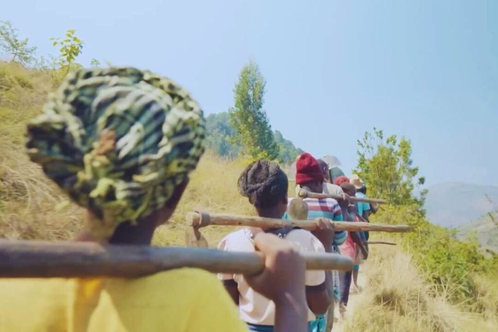 Coffee workers travelling through the Rwandan landscape
